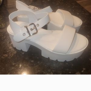 NEW IN BOX SANDALS, run larger